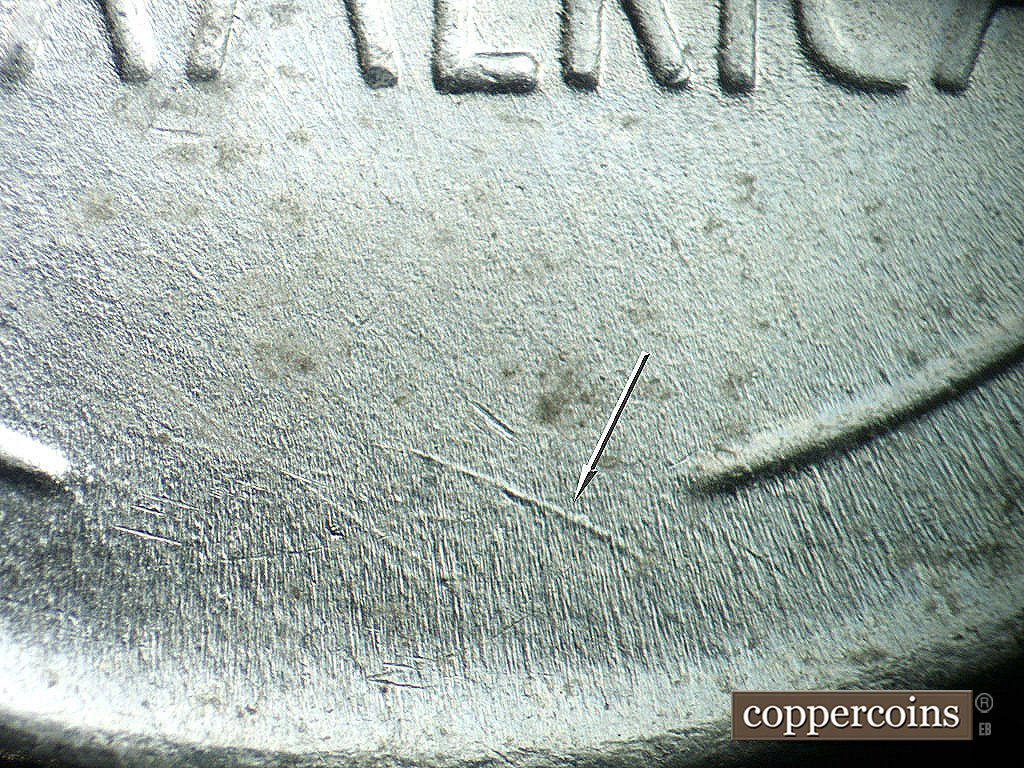 Die-stage B marker on 1943P•1DO•039 showing Curved die scratch between wheat stems.