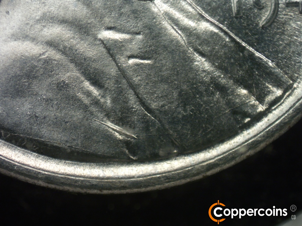 Die-stage B marker on 1943P•1DO•040 showing Die cracks form a network across the bust in typical weak areas.