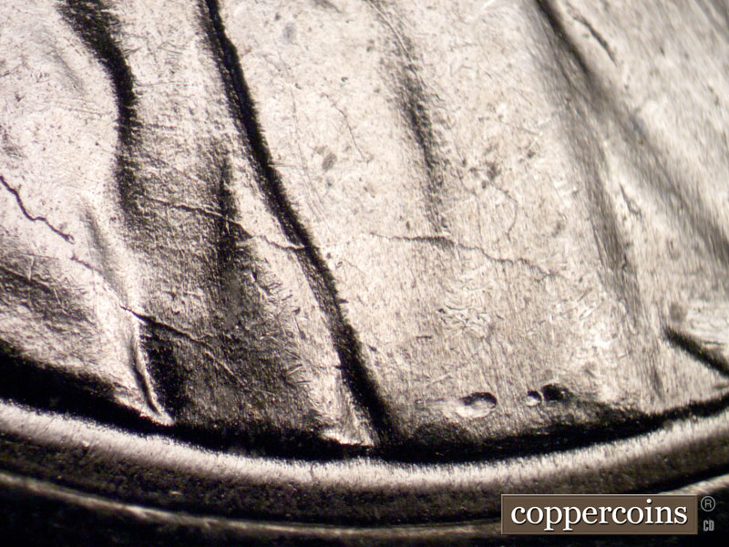 Die-stage B marker on 1943P•1DR•002 (1943 Doubled Die Reverse).