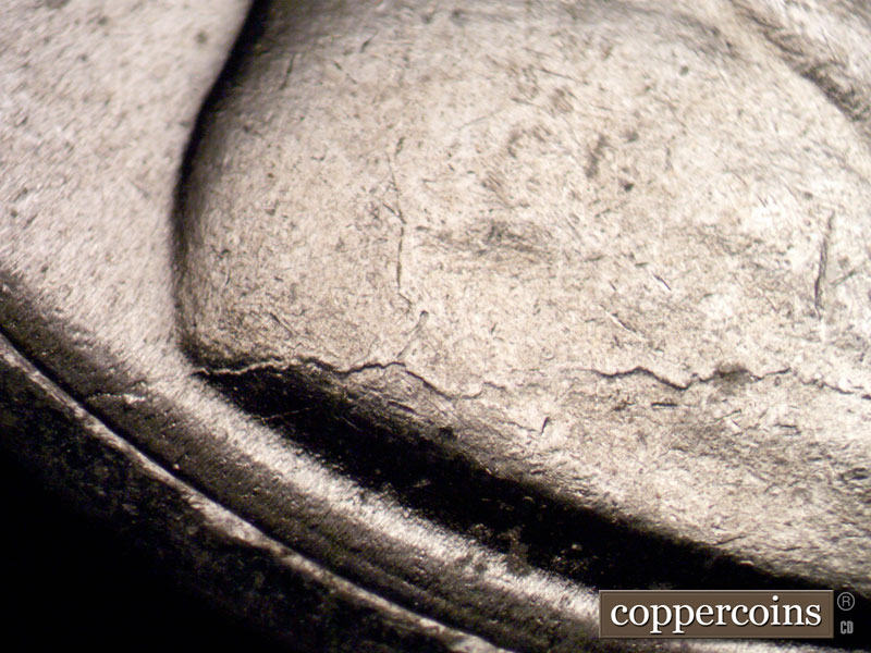 Die-stage B marker on 1943P•1DR•002 (1943 Doubled Die Reverse).