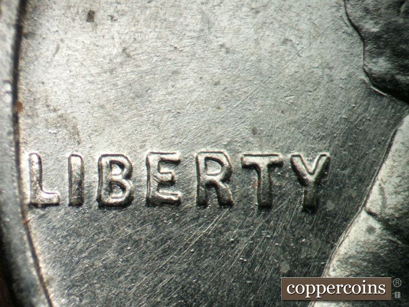 Die-stage B marker on 1943P•1DR•004 (1943 Doubled Die Reverse).