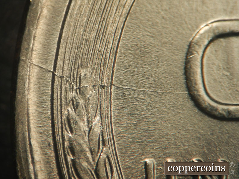 Die-stage B marker on 1943P•1DR•008 (1943 Doubled Die Reverse).