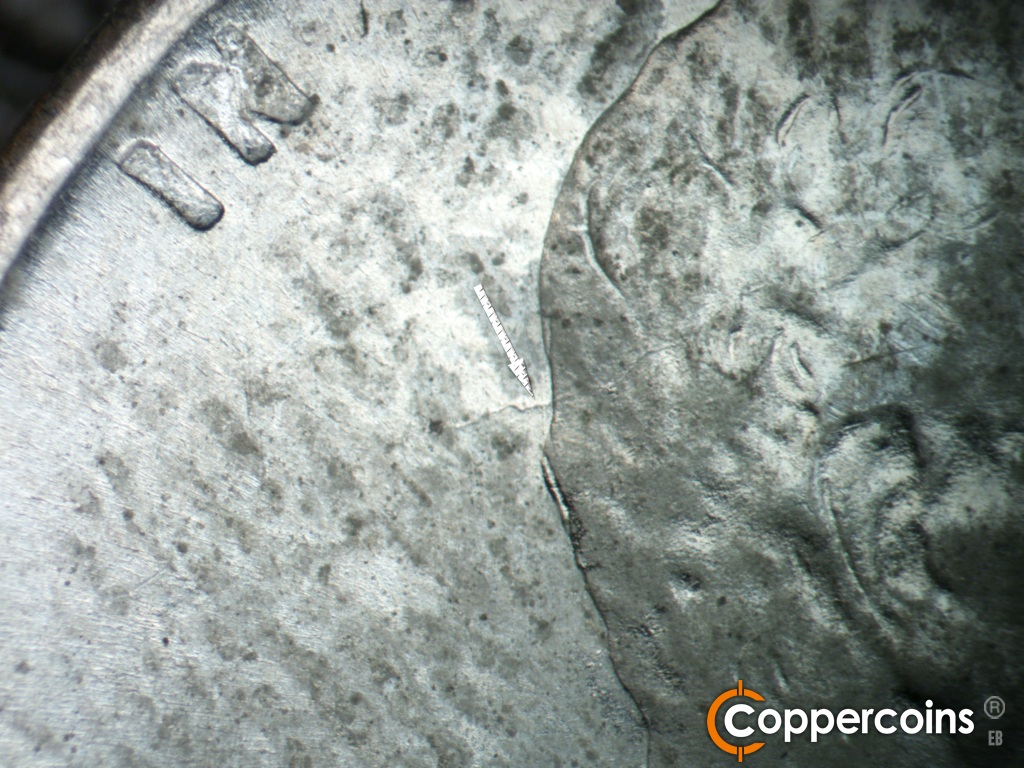 Die-stage C marker on 1943S•1DO•014 showing Die crack into back of head.