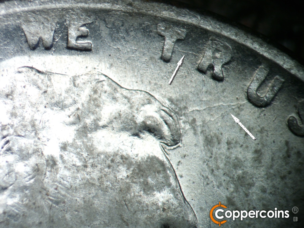 Die-stage C marker on 1943S•1DO•014 showing Die crack connect TR in TRUST. Die cracks from front of hair to U in TRUST.