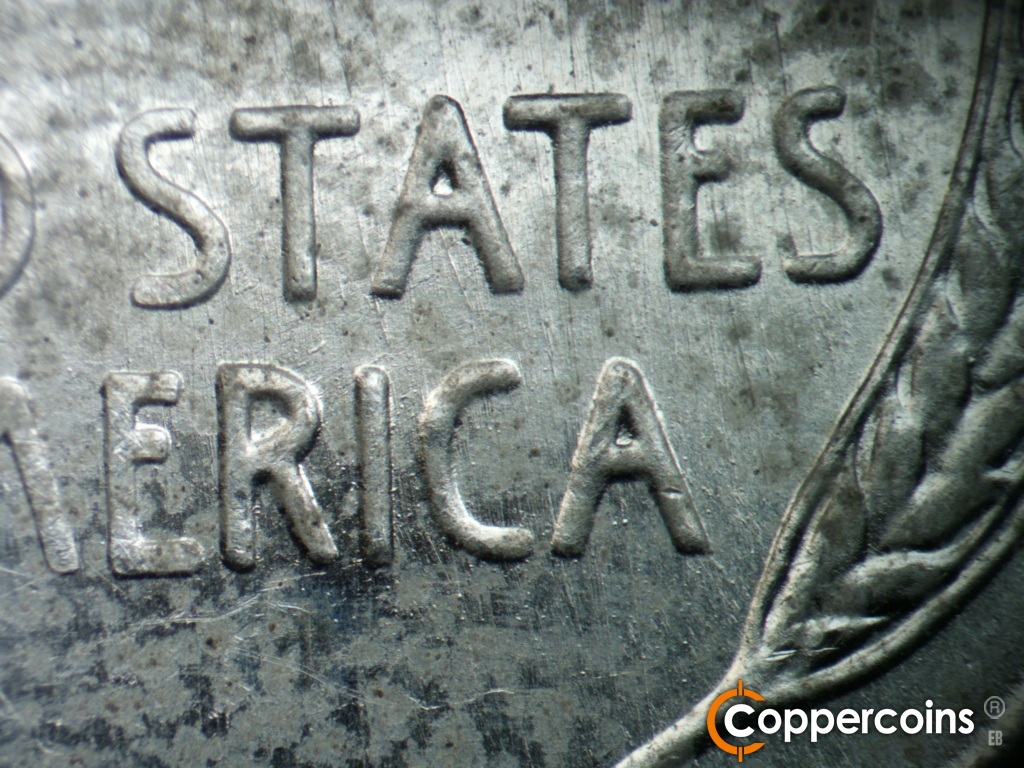 Die-stage C marker on 1943S•1DO•014 showing SSE die scratches through STATES and AMERICA.