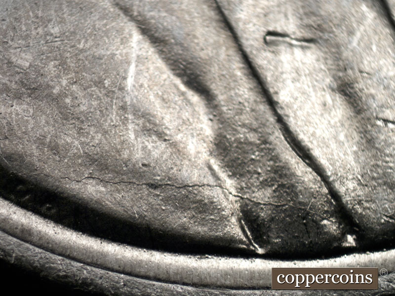 Die-stage B marker on 1943S•1DR•001 (1943 Doubled Die Reverse).