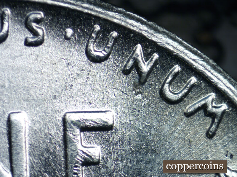 Die-stage B marker on 1943S•1DR•004 (1943 Doubled Die Reverse).