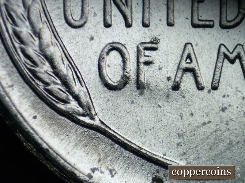 Die-stage B marker on 1943S•1DR•004 (1943 Doubled Die Reverse).