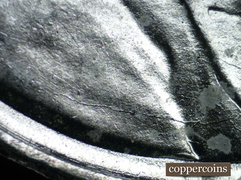 Die-stage B marker on 1943S•1DR•004 (1943 Doubled Die Reverse).