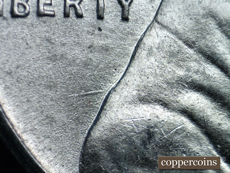 Die-stage B marker on 1943S•1DR•005 (1943 Doubled Die Reverse).