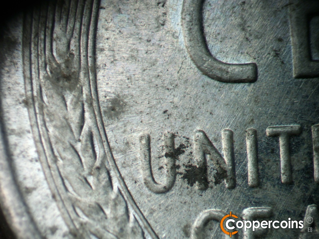 Die-stage A marker on 1943S•1DR•006 showing Generally SW die scratches through UNITED.