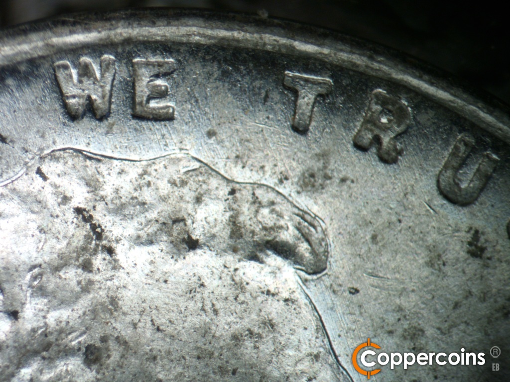 Die-stage A marker on 1943S•1DR•006 showing NNW s=die scratches from top of hair into WE.