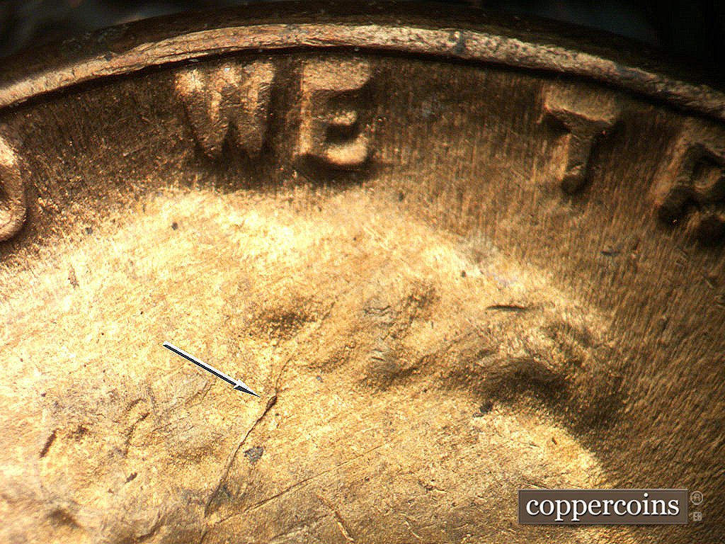 Die-stage C marker on 1944D•1DO•001 showing Die crack in hair.
