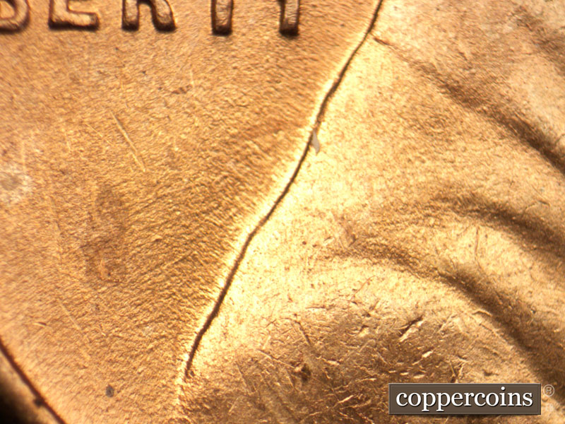 Die-stage B marker on 1944D•1DR•005 (1944 Doubled Die Reverse).