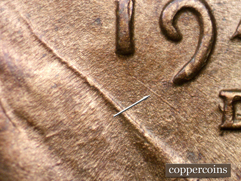 Die-stage A marker on 1944D•1OM•002 showing SE die scratch under 19 in date.