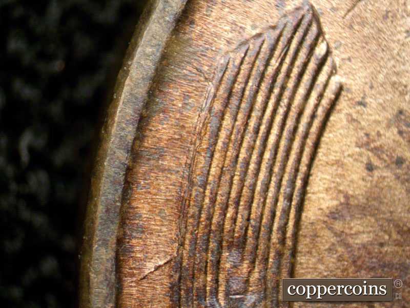 Die-stage A marker on 1944D•1OM•002 showing Die crack from left wheat stalk to rim.