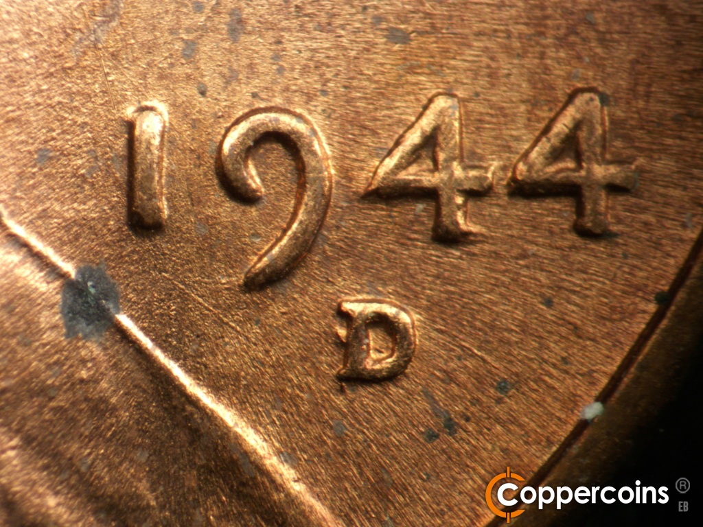 Die-stage B marker on 1944D•1OM•002 showing Closeup of over mint mark. SE die scratch under 19 in date.