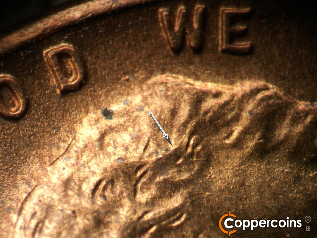 Die-stage B marker on 1944D•1OM•002 showing Die crack in hair.