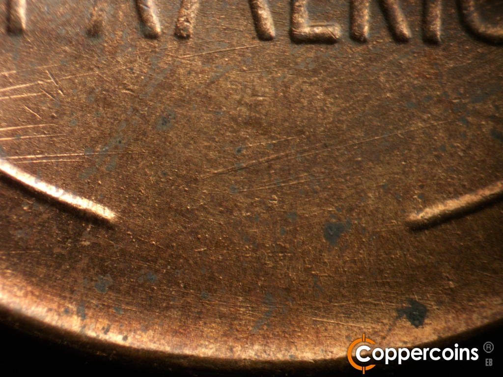 Die-stage B marker on 1944D•1OM•002 showing Die scratches on the bottom of the reverse.