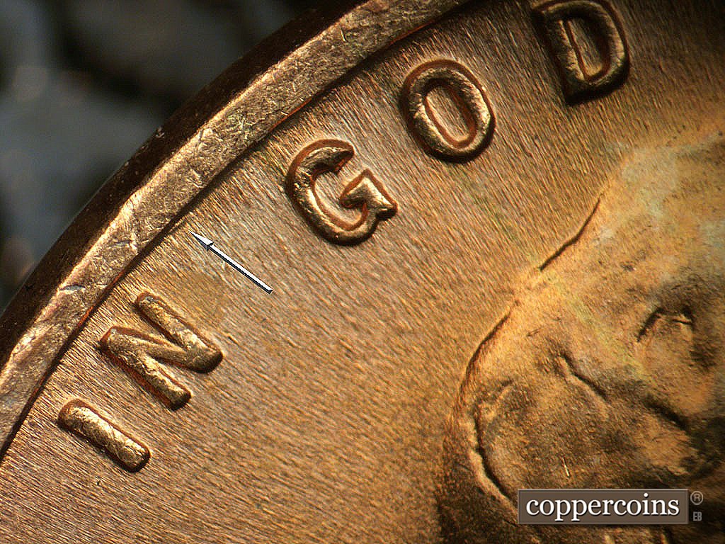 Die-stage B marker on 1944P•1DO•038 showing Die gouge near rim between IN and GOD.