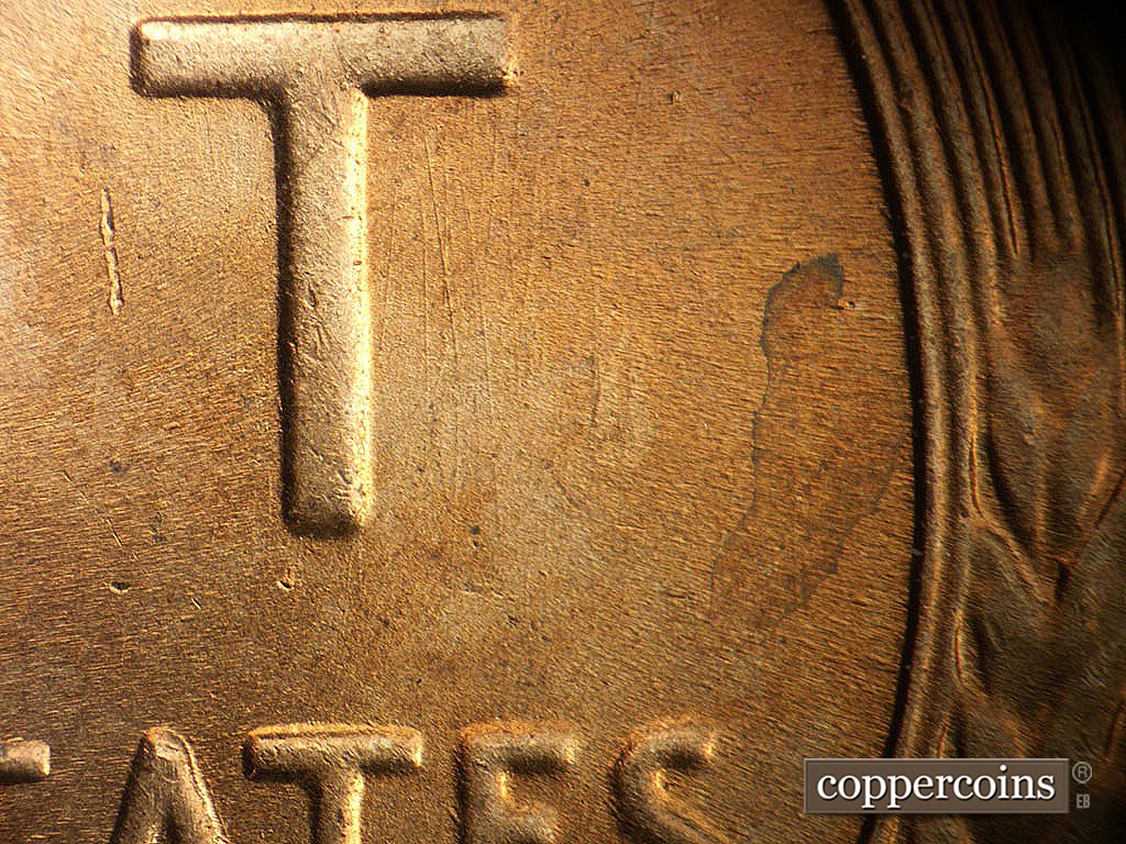 Die-stage B marker on 1944P•1DO•038 showing N/S die scratches to the right of T in CENT.