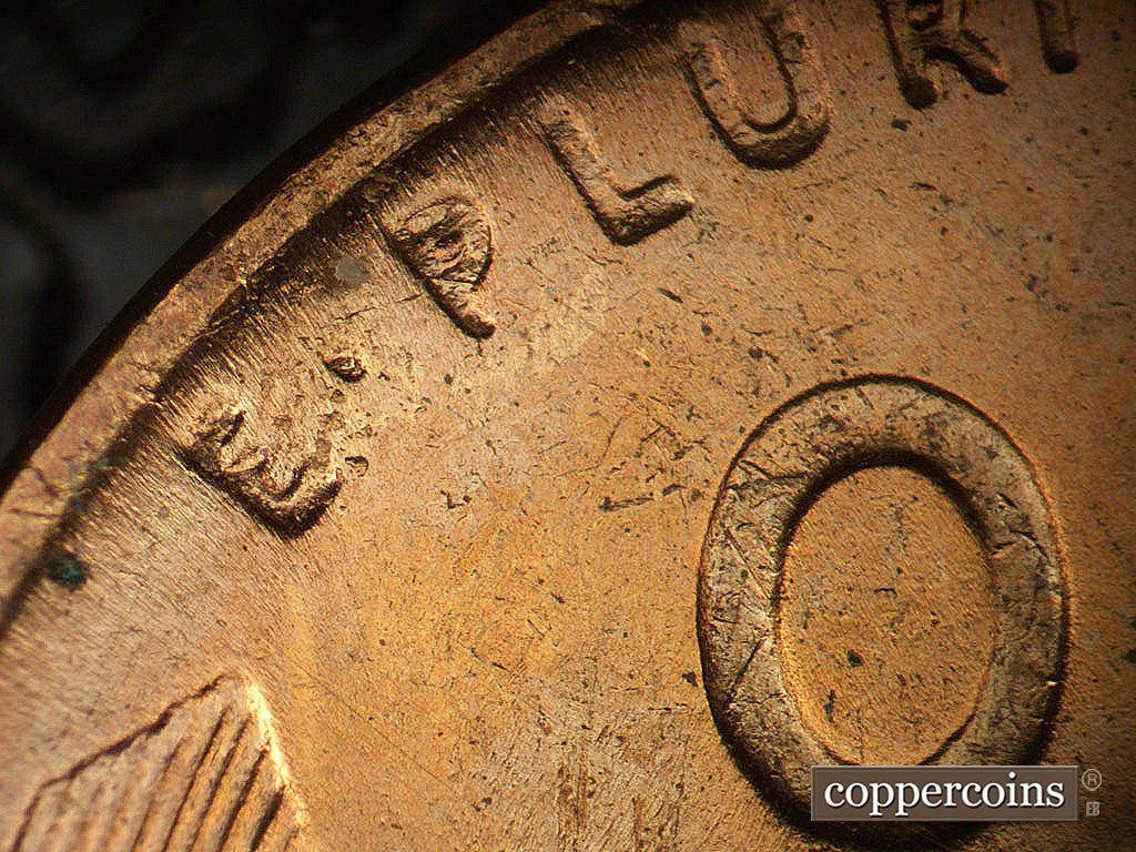 Die-stage B marker on 1944P•1DR•010 showing Mild extra thickness on E PLURIBUS UNUM an left wheat tip.