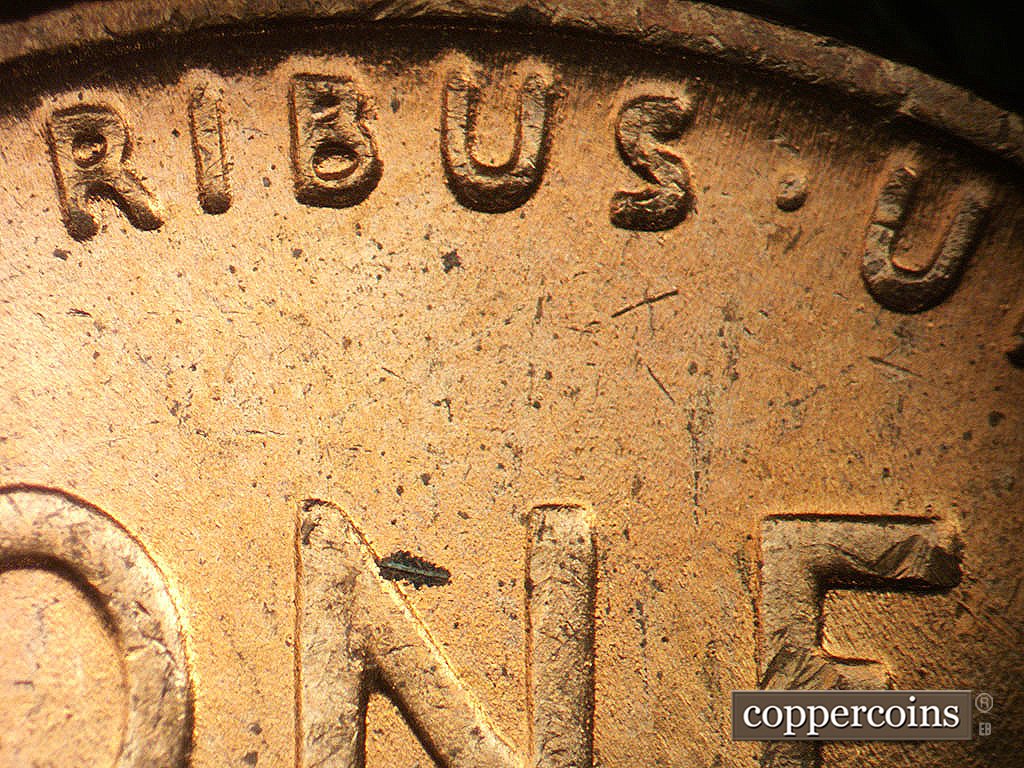 Die-stage B marker on 1944P•1DR•010 showing Mild extra thickness on E PLURIBUS UNUM an left wheat tip.