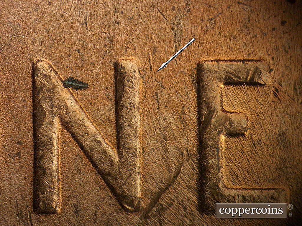 Die-stage B marker on 1944P•1DR•010 showing N/S die gouge between NE in ONE.