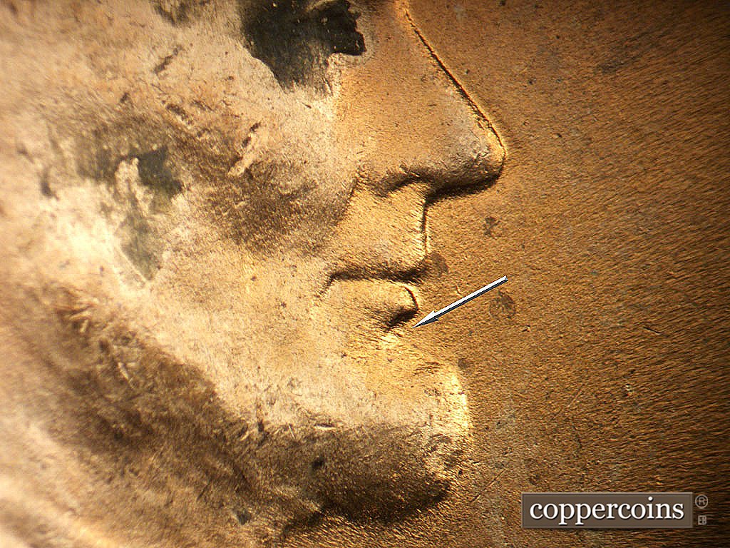 Die-stage B marker on 1944P•1DR•010 showing Small die dot under lower lip.
