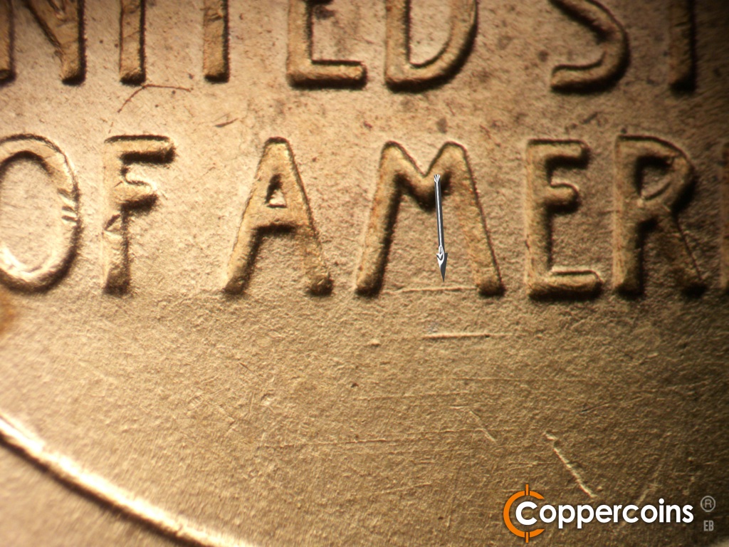 Die-stage B marker on 1944S•1DR•007 showing E/W die scratches under M in AMERICA.
