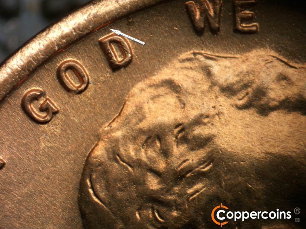 Die-stage C marker on 1944S•1MM•004 showing Concentric die scratch between rim and GOD.