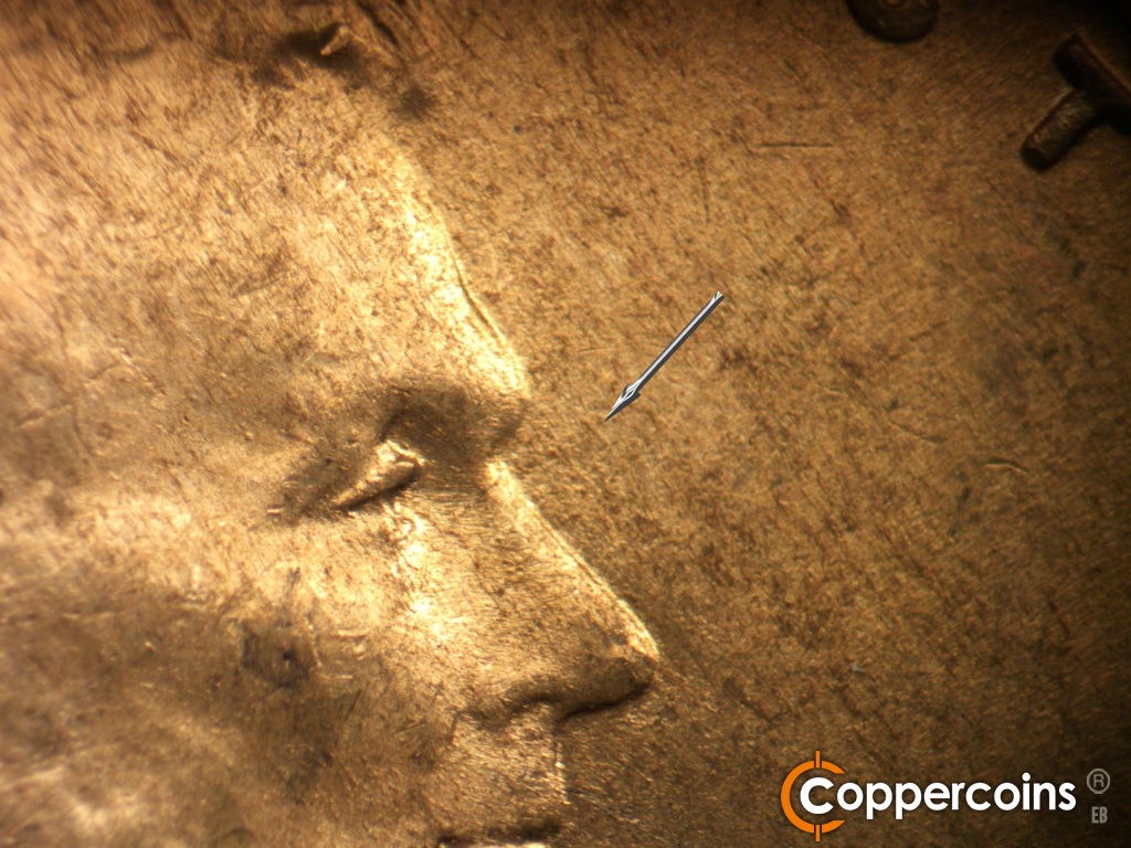 Die-stage A marker on 1945D•1MM•005 showing Light SE die scratches in front of nose.