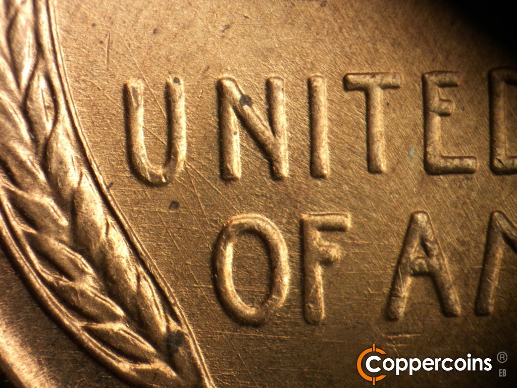 Die-stage A marker on 1945D•1MM•005 showing An X shaped die scratch bisects the U of UNITED.