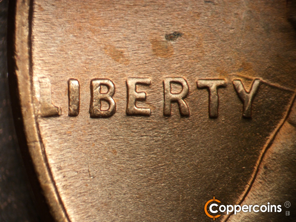 Die-stage B marker on 1945P•1DO•013 showing Mild extra thickness on LIBERTY.