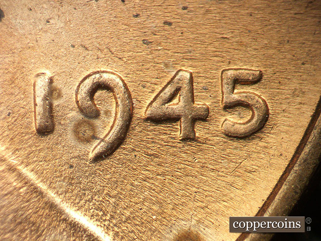 Die-stage B marker on 1945P•1DO•022 showing Mild extra thickness on date.