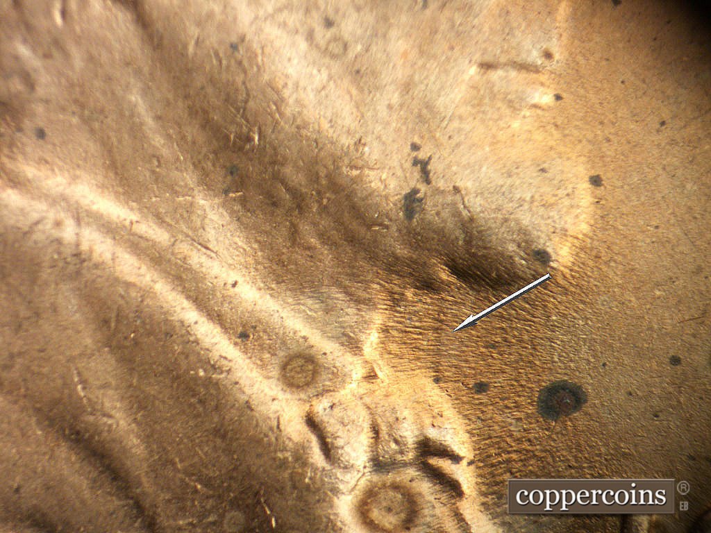 Die-stage B marker on 1945P•1DO•022 showing Die clash near throat.