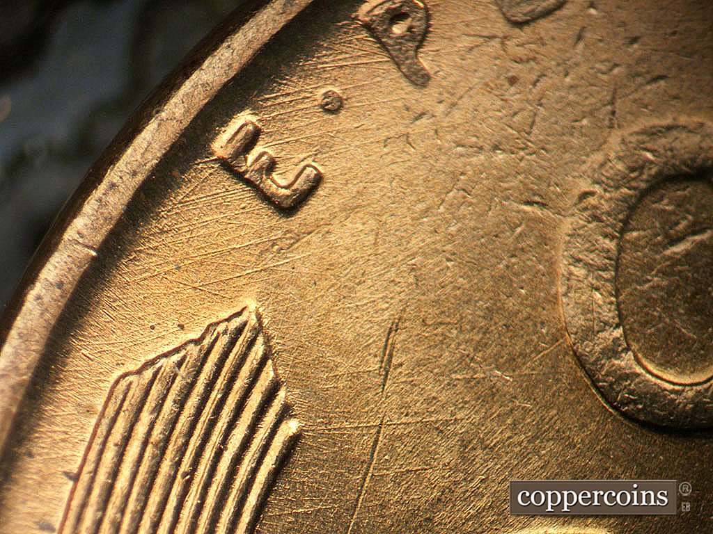 Die-stage A marker on 1945P•1DO•023 showing ENE die scratches through E in E PLURIBUS.