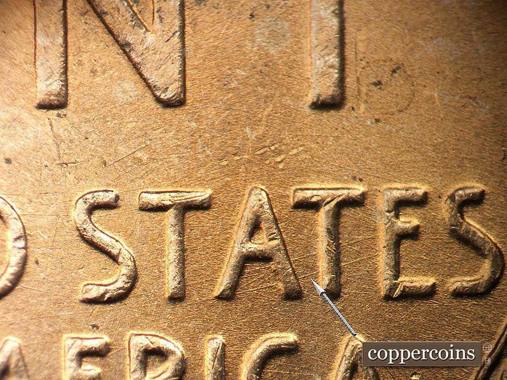 Die-stage A marker on 1945P•1DO•023 showing Pair of ene die scrtches through TAT in STATES.