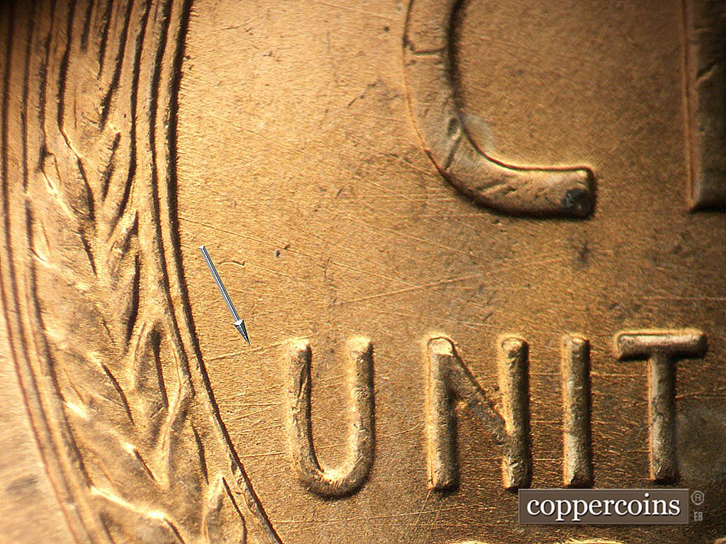 Die-stage A marker on 1945P•1DO•023 showing ENE die scratch connect left wheat stalk to U in UNITED, Die scratches in field between CENT and UNITED.