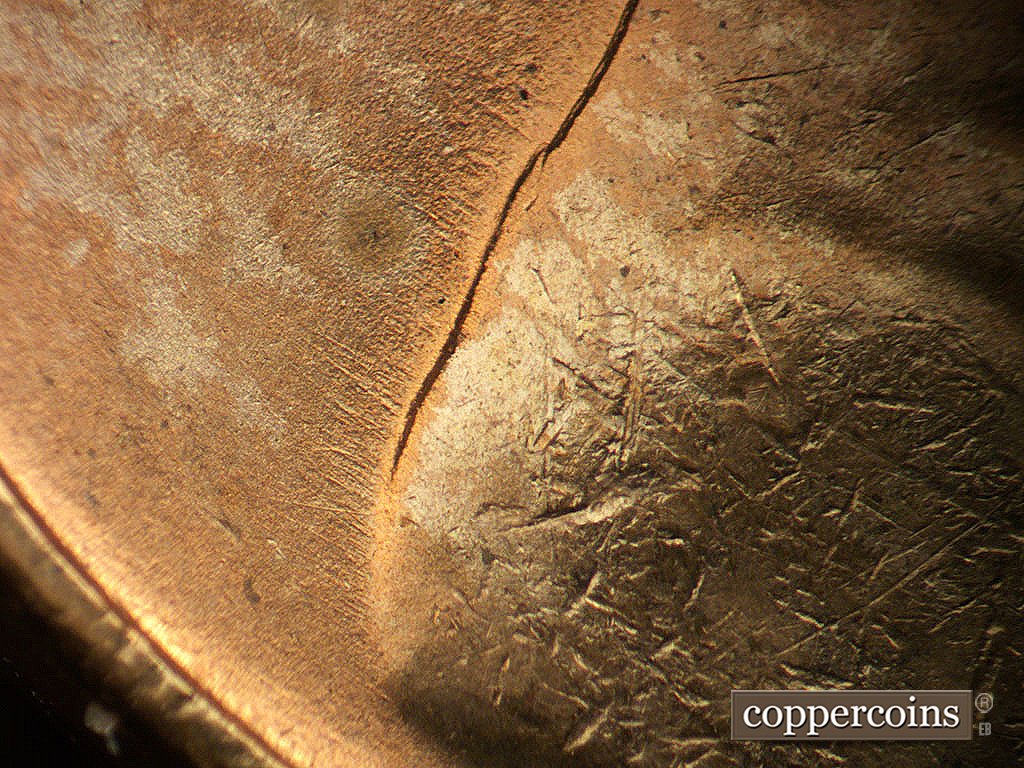 Die-stage B marker on 1945P•1DO•024 showing Short NW die scratches from back of jacket.