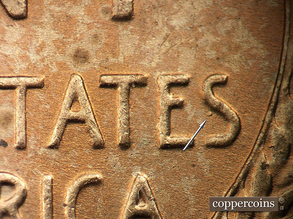 Die-stage B marker on 1945P•1DO•024 showing Die gouge near last S in STATES.