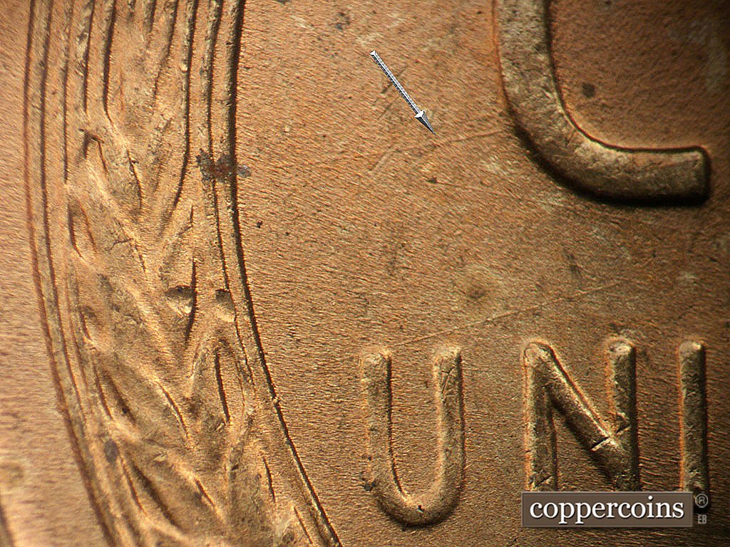 Die-stage B marker on 1945P•1DO•024 showing ENE die scratch through C in CENT. NE die scratch above UN in UNITED.