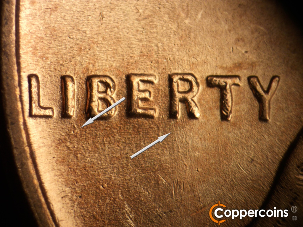 Die-stage B marker on 1945P•1DO•025 showing Die dot under I in LIBERTY. Die scratch from bottom of first leg in R of LIBERTY.