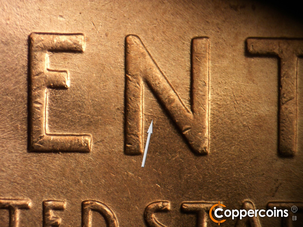 Die-stage B marker on 1945P•1DO•025 showing ESE die scratch in N of CENT.