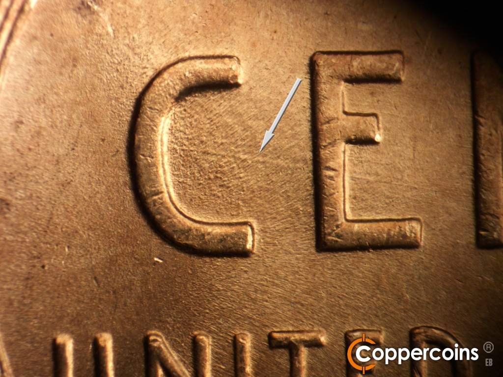 Die-stage B marker on 1945P•1DO•025 showing ESE die scratch inside of C in CENT.