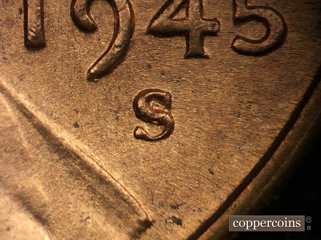 Die-stage B marker on 1945S•1MM•031 showing Extra thickness on top curve and split upper serif.
