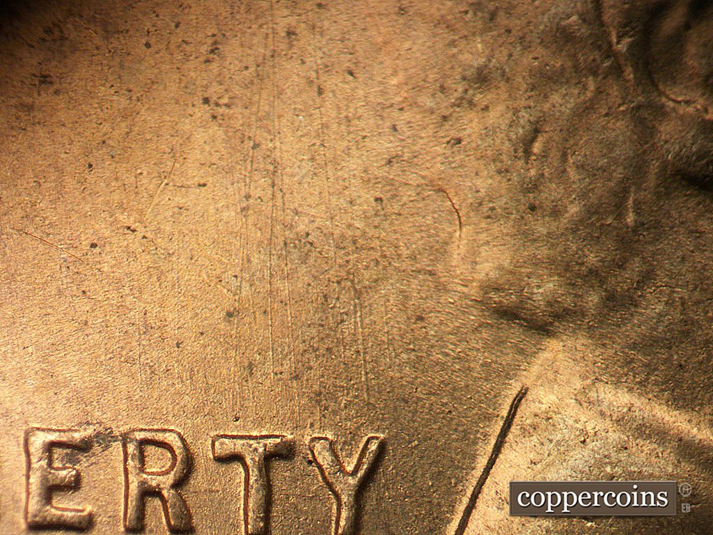 Die-stage B marker on 1945S•1MM•031 showing N/S die scratches from top of LIBERTY.