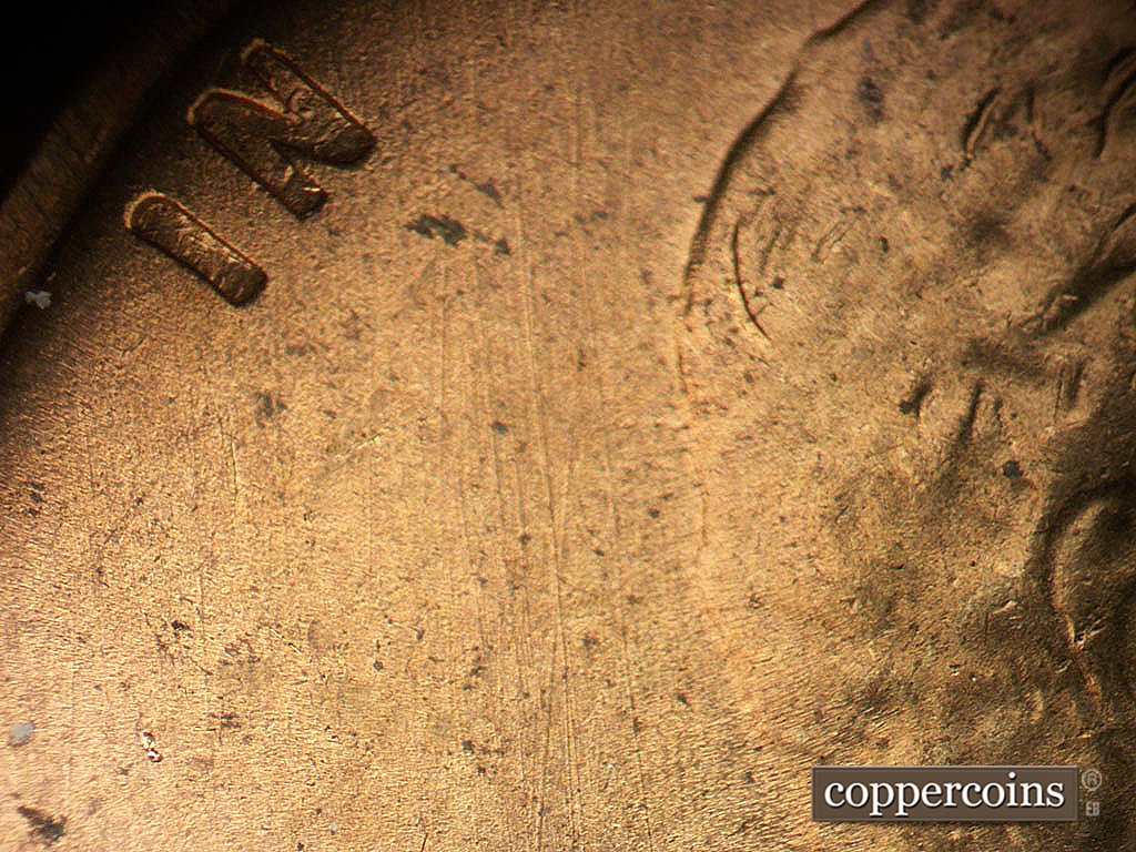 Die-stage B marker on 1945S•1MM•031 showing N/S die scratches.
