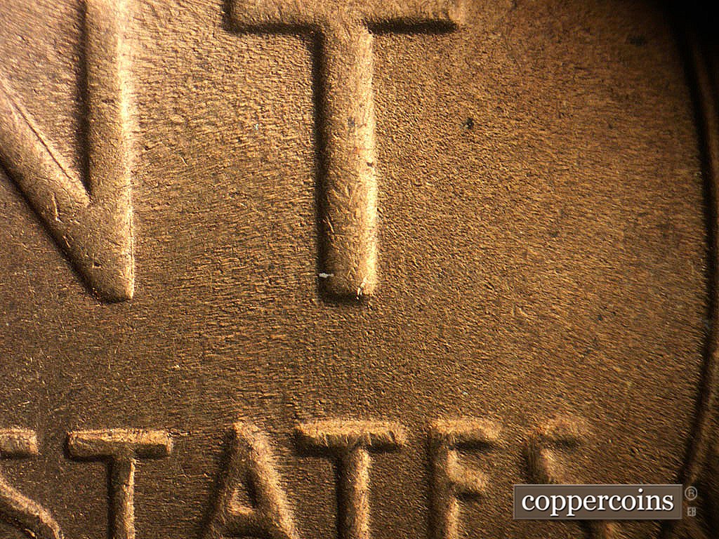 Die-stage B marker on 1945S•1MM•031 showing Light worn N/S die scratches between T in CENT and second T in STATES.
