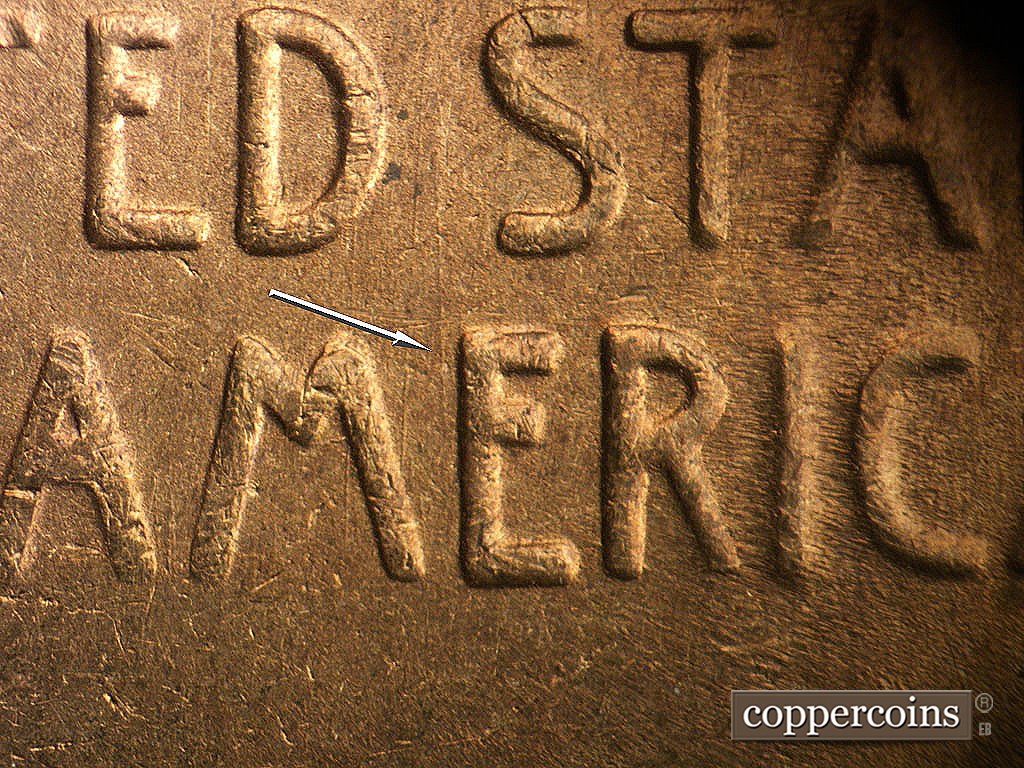 Die-stage B marker on 1945S•1MM•031 showing N/S die scratch just left of E in AMERICA.